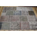 A patch work rug, 220 x 170cm