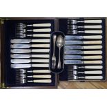 A cased set of silver and ivory fish knives and forks and cased christening set