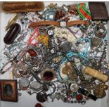 A quantity of mixed jewellery and other items including silver, medals, ambrotype, watches and