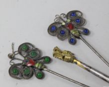 Three metal, glass and enamel hair ornaments