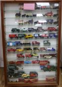 A large collection of diecast model vehicles, various, three glazed display cabinets and a box (