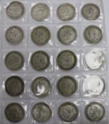 An album of UK silver coinage Charles II to George V including James I shilling and other coins