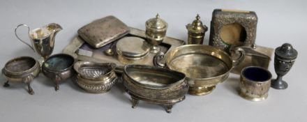 A small group of assorted silver items, including a photograph frame, condiments, cream jug and