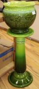 A Victorian Staffordshire green glazed jardiniere on a green pedestal H.89cm