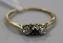 An 18ct gold, sapphire and diamond three stone ring, size Q.