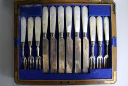 A cased set of twelve pairs of late Victorian mother of pearl handled silver dessert eaters,