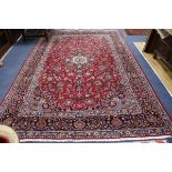 A Kashan red ground carpet 330 x 215cm