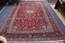 A Kashan red ground carpet 330 x 215cm