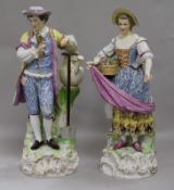 In the manner of Augustus Rex. A pair of Helena Wolfshon Dresden porcelain figures of gardeners,