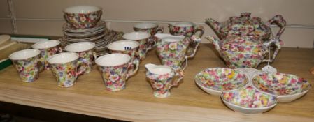 A James Kent chintz-decorated matched tea service, including 'Du Barry' comprising a teapot and