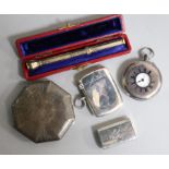 Two silver vesta cases, a silver cased travelling timepiece, a silver fob watch and a gold