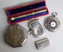 Two silver vesta cases, a silver cased travelling timepiece, a silver fob watch and a gold