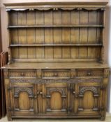 An early 20th century Jacobean style carved oak high back dresser W.169cm