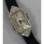 A lady's 1920's/1930's 18ct white gold and diamond set cocktail watch.
