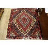 A red ground baseweave rug 150 x 130cm