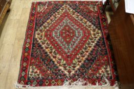 A red ground baseweave rug 150 x 130cm