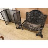 A pair of fire dogs, a fire basket and iron fire back and spark guard fire back W.84cm