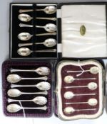 Three assorted cased sets of silver coffee spoons.