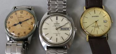 A gentleman's steel Omega Constellation wrist watch and two other watches.