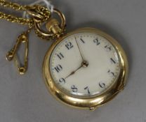 An 18ct gold fob watch on a gilt metal chain.