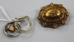 Two gold bands including one 9ct, two platinum bands, a yellow metal gold brooch and a 9ct gold