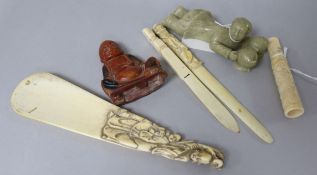 A collection of Asian carved ivory and hardstone items, including two ivory paperknives, a