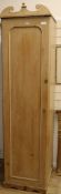 A pine hanging wardrobe W.52cm