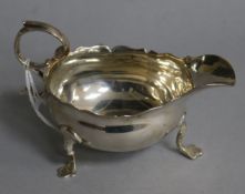 A George II silver sauceboat with flying scroll handle, circa 1755( marks rubbed), 3.5 oz.