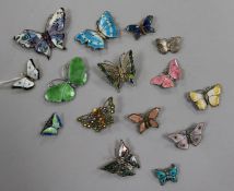 Fourteen assorted butterfly brooches including silver and enamel and filligree and a butterfly