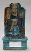 A Chinese Fahua-decorated seated figure of an emperor, Ming dynasty, on a moulded plinth, label