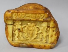 A piece of raw amber carved with the crest of the Polish City of Gdansk with the date "997-1997",