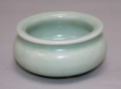 A Chinese Celadon glazed tripod censer