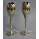 A pair of early 20th century silver tulip shaped spill vases, marks rubbed on one, 17.3cm.