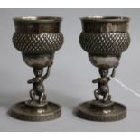 A pair of continental white metal goblets with Bacchus figural stems, 10.5cm.