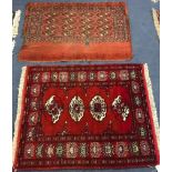 A small red ground mat and another 109cm x 78cm, 103cm x89cm