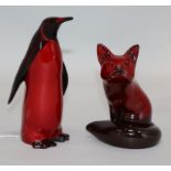 A Royal Doulton penguin and fox