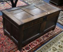 A 17th century oak coffer w.122cm