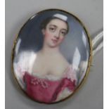 A yellow metal mounted porcelain oval brooch decorated with a portrait of a lady, 48mm.