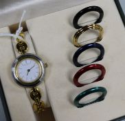 A Gucci ladies' wristwatch with interchangeable bezels and papers, boxed.