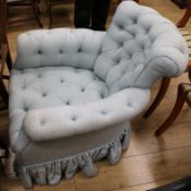 An upholstered button back chair