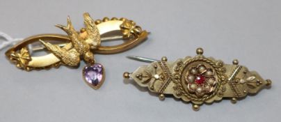 A late Victorian 9ct gold "swallow" brooch with heart shaped amethyst drop and an Edwardian 9ct gold