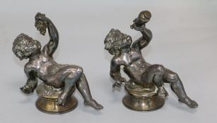 A pair of silvered bronze cherubs