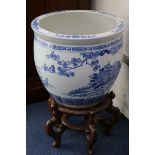 Two Chinese blue and white fish bowls on stands