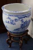 Two Chinese blue and white fish bowls on stands