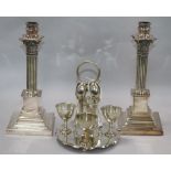 A pair of epns Corinthian column candlesticks and an egg stands