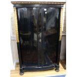 A pair of early 19th Biedermeier ebonised and ormolu cabinets W.110cm