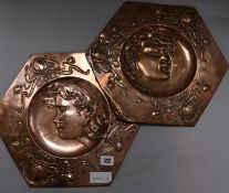 A pair of Art Nouveau copper hexagonal wall plates