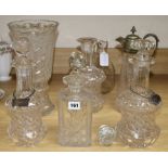 A collection of continental glass decanters, claret jug with plated mount, a decanter and a cut