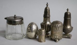 Five assorted silver condiments and a plate mounted glass mustard.