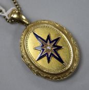 A Victorian yellow metal, enamel and seed pearl oval locket on chain, locket 48mm.
